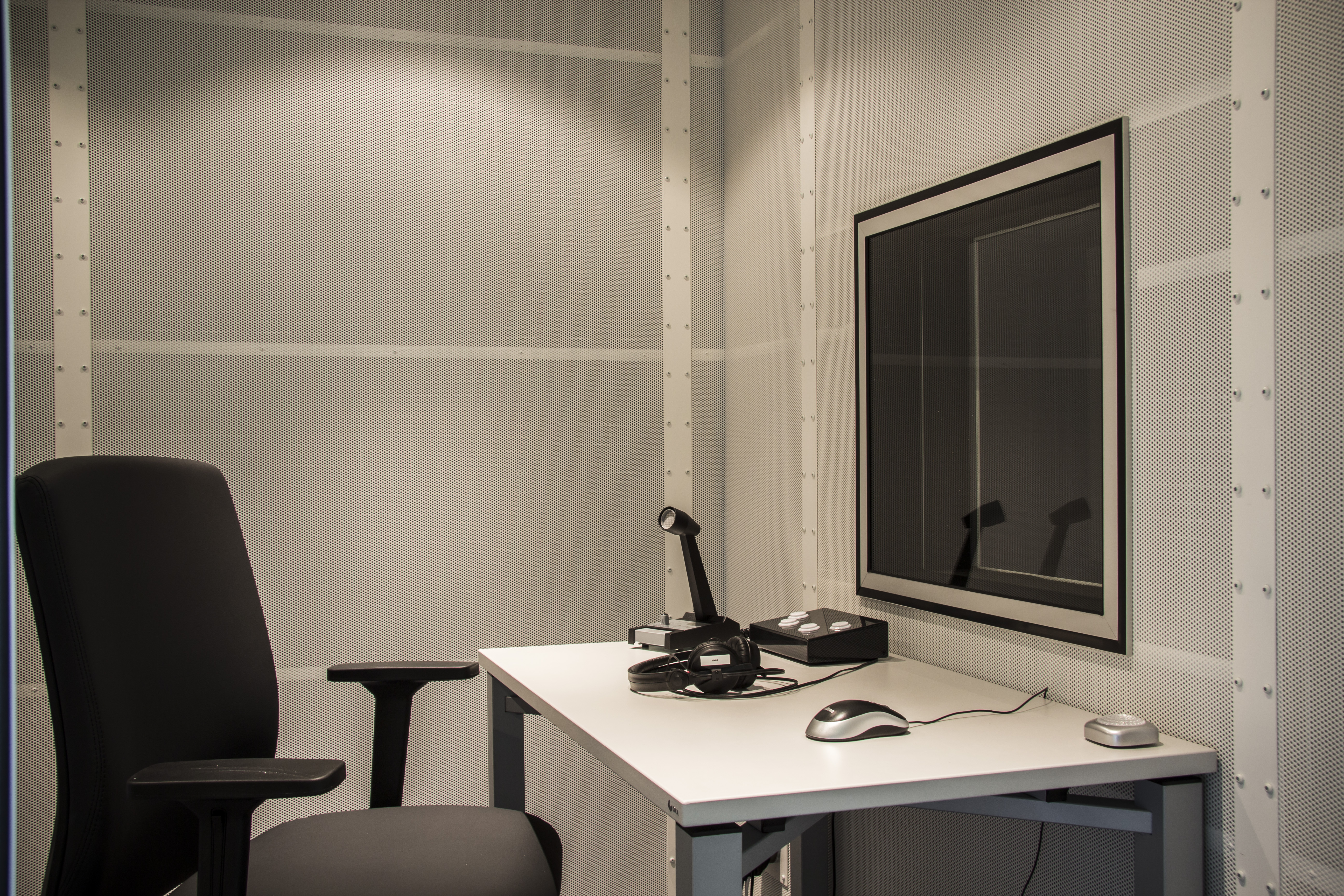 sound-attenuated room, interior with chair, desk and input devices