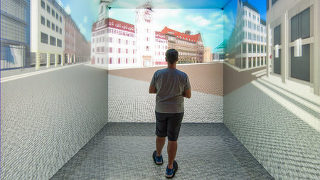 Eine Testperson steht im VR-Studio und schaut auf den simulierten Chemnitzer Marktplatz.