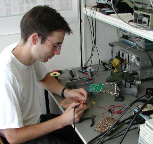 K. Hammer at the soldering station