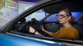 Test subject using an eyetracker in the driving simulator