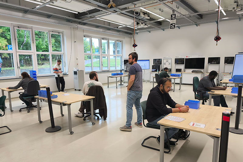 A masters student hosted and facilitated a hands-on Lean Management workshop developed by the Chair of Factory Planning and Intralogistics.