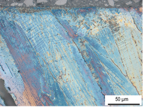 Querschliff einer diamantgeglätteten und Beraha II geätzten X120Mn12 LMD Schicht 