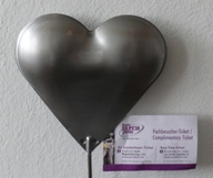 Tin heart with conference ticket