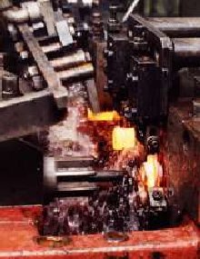 Photo of a hot forming process with cooling lubricant