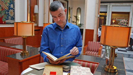 Prof. Christoph Fasbender looks into a book