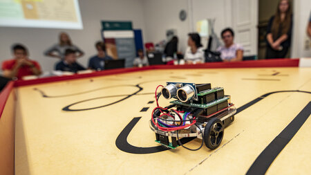 A robot is driving on a table.