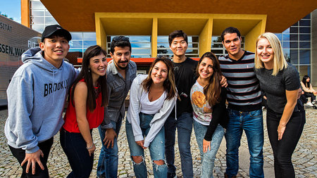 Young and international people smiling.