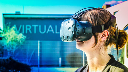 A young woman wears a VR headset.