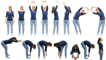 A woman demonstrates fourteen different stretches.