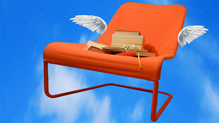 Armchair with wings in the sky. There are several books stacked on the armchair.
